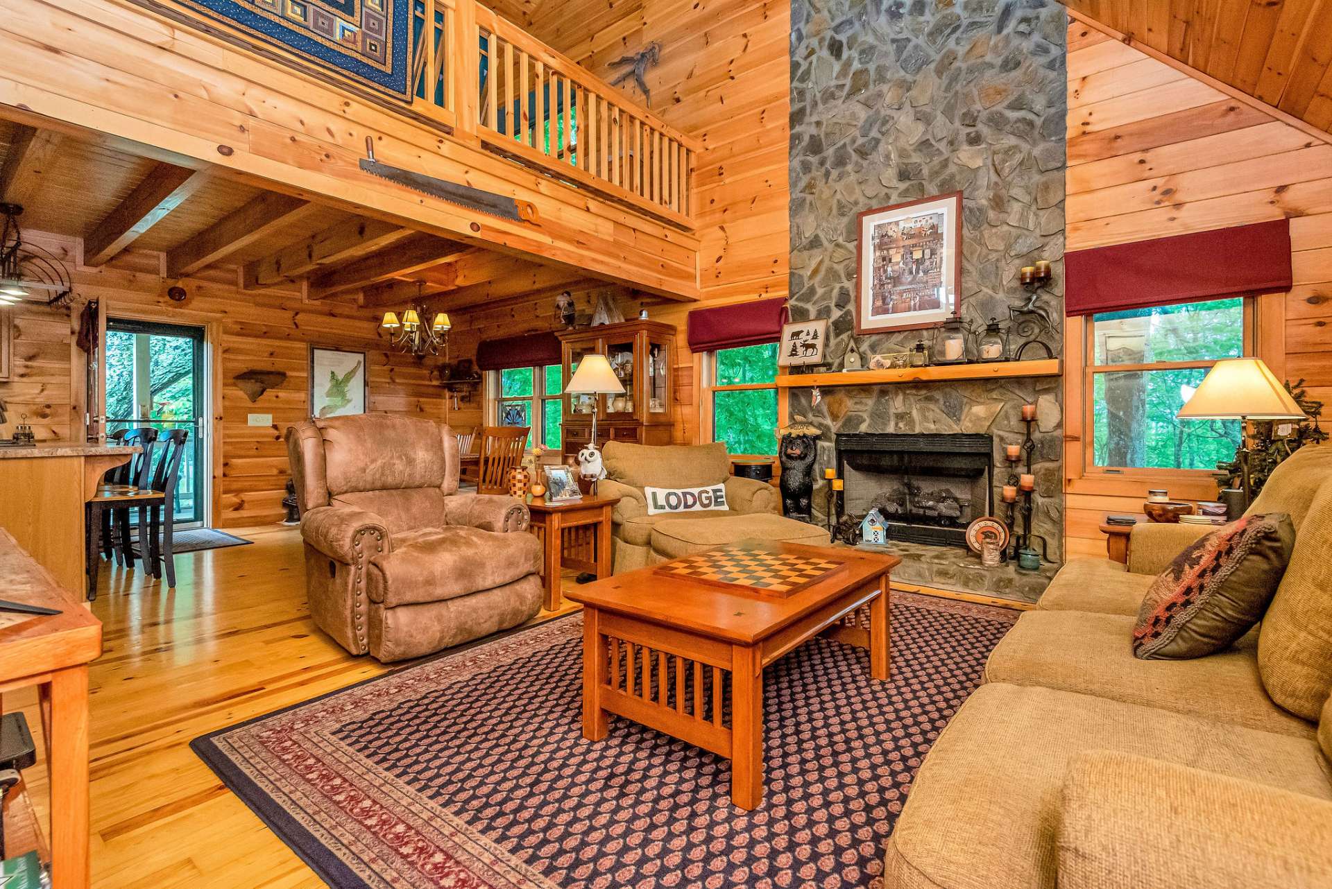 The living room is a cozy haven, featuring vaulted ceilings that create an airy atmosphere.